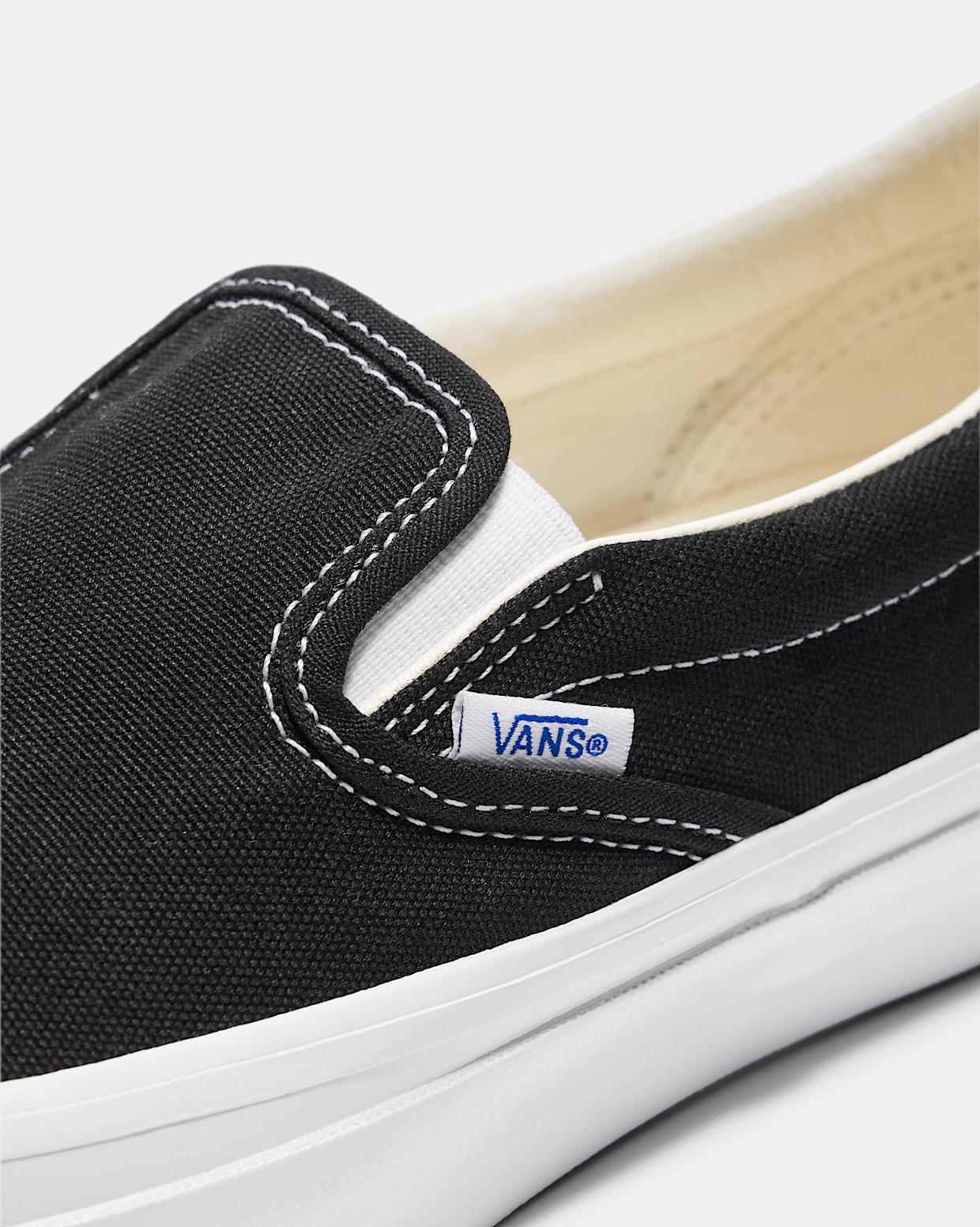Premium Slip On 98 in Black White Vans