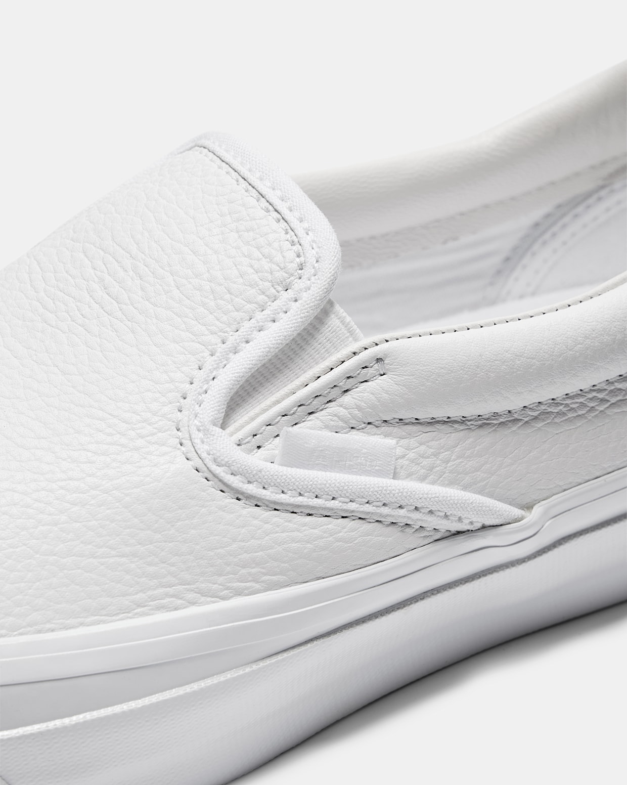 Premium Slip On 98 in White Vans